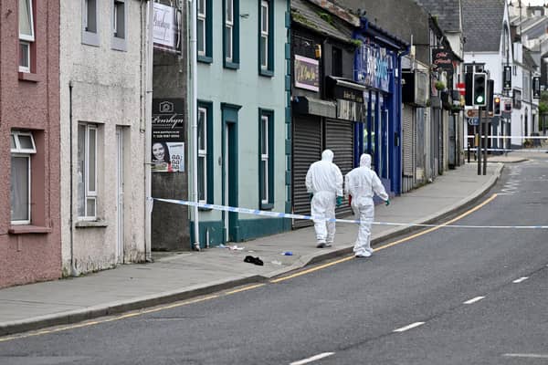 Scene of crimes officers pictured at the scene of an overnight  incident which happened at Bridge street in Comber. Picture: Presseye/Stephen Hamilton