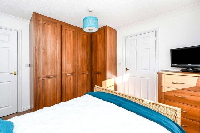 Here is the master bedroom, which boasts fitted wardrobes, a uPVC double-glazed window to the side of the property and a central heating radiator. It also has its own en suite.