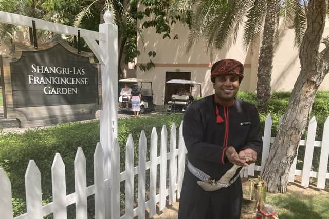 Khalid Al Amri welcomes guests to the resort's frankincense garden.