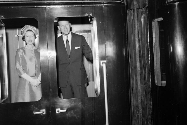 The Queen and Duke of Edinburgh leave Princes Street Station on a train in July 1963.