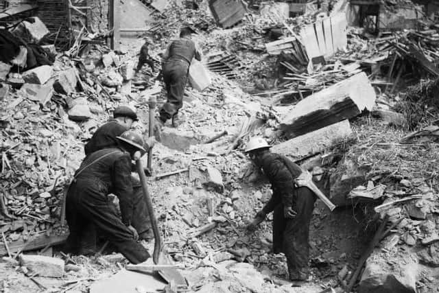 Rescue workers searching through rubble during Belfast blitz