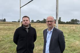 Deputy mayor James Cochrane and MLA Peter Martin at the site of disused playing fields on a suburban edge of Bangor, which have reportedly been picked as a site for a new cemetery at secret council meetings.