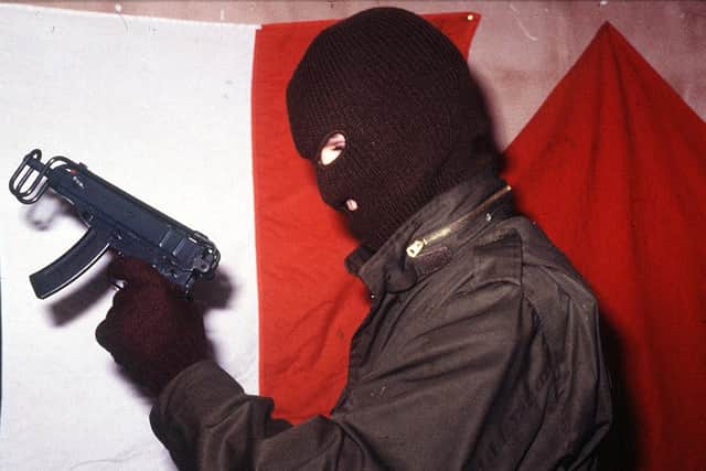 An INLA gunman at a press conference on the Irish border in 1990 - Pacemaker