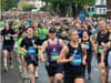 Biggest ever Belfast marathon passing along main road near Stormont, taking a full 20 minutes for all runners to go by