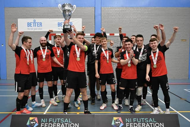 Darius Roohi lifts the NIFF Super League title as captain of Sparta Belfast Futsal Club. PIC: Andrew McCarroll/AM Photography NI Sport
