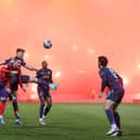 Rangers Scott Wright and Dundee's Aaron Donnelly during the cinch Premiership match at  Dens Park, which was delayed due to traffic and suspended briefly when Rangers fans lit flares