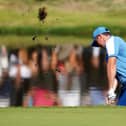 Team Europe's Rory McIlroy chips on the 16th, during the foursomes on during day one of the 44th Ryder Cup at the Marco Simone Golf and Country Club, Rome, Italy