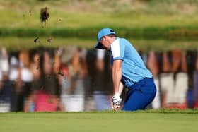 Team Europe's Rory McIlroy chips on the 16th, during the foursomes on during day one of the 44th Ryder Cup at the Marco Simone Golf and Country Club, Rome, Italy