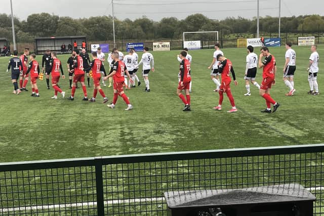 Annagh United and Queen's University players before kick-off in the Boyle Sports Championship clash at Tandragee Road. (Photo by Iconic Media Group)