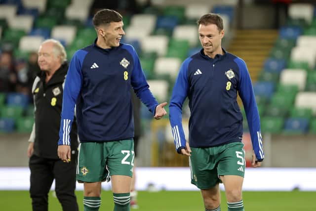 Eoin Toal during the warm-up with Manchester United's Jonny Evans before Tuesday’s UEFA Euro 2024 Qualifier against Slovenia at the National Football Stadium at Windsor Park, Belfast. PIC: William Cherry/Presseye