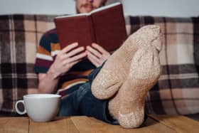 A man relaxes with a cup of tea. Ben Lowry says that not infrequently his entire fluid intake in a day is tea: one large mug of it after another
