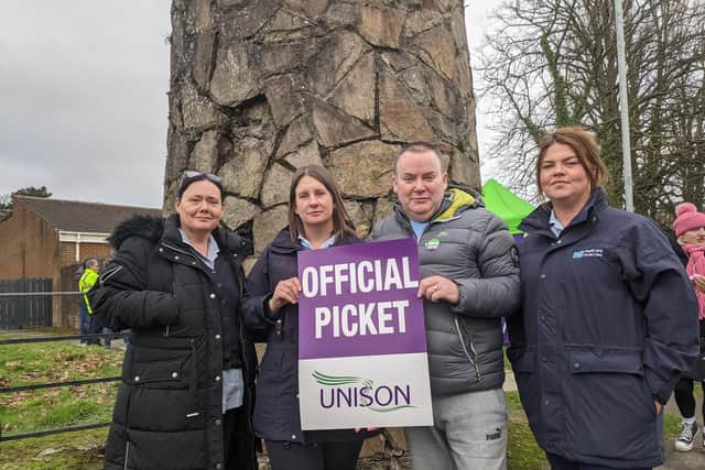 Unison members, including healthcare assistant in the community Carmen Brady-James (left), and nursing assistant at Carnhill Hospital John Quinn (second from right) at a picket line at Altnagelvin Hospital on Thursday