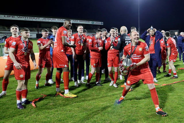 Portadown's players celebrate after receiving the Playr-Fit Championship trophy