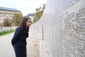 Home Secretary Suella Braverman looks at some of the names on the Shoah Wall in Vienna of Austrian Jews who died during the Holocaust, earlier this month. She has in an article said: "They are an assertion of primacy by certain groups - particularly Islamists - of the kind we are more used to seeing in Northern Ireland" Pic: Stefan Rousseau/PA Wire