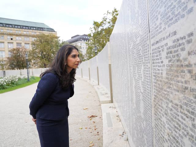 Home Secretary Suella Braverman looks at some of the names on the Shoah Wall in Vienna of Austrian Jews who died during the Holocaust, earlier this month. She has in an article said: "They are an assertion of primacy by certain groups - particularly Islamists - of the kind we are more used to seeing in Northern Ireland" Pic: Stefan Rousseau/PA Wire