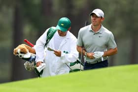 Rory McIlroy and his caddie caddie Harry Diamond react on the eighth green during the second round of the 2023 Masters Tournament at Augusta National Golf Club.