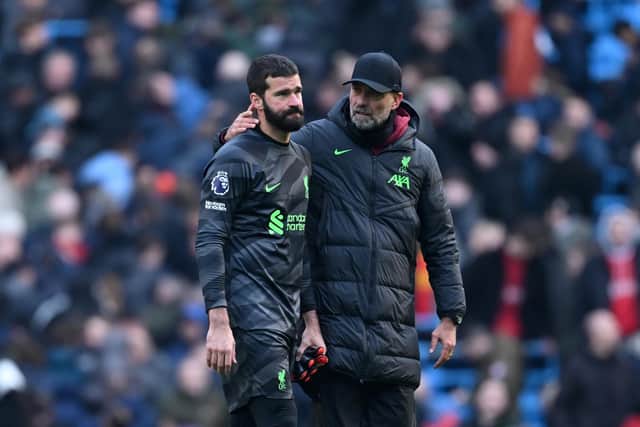 Liverpool goalkeeper Alisson Becker with manager Jurgen Klopp after he sustained an injury in the Premier League match against Manchester City on Saturday
