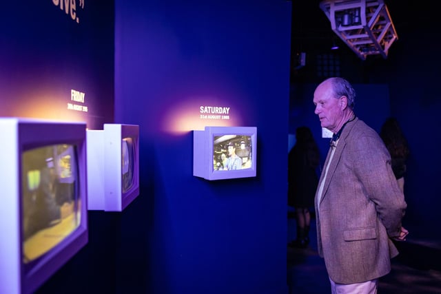 Dr Ballard views his gallery - Ballard's Quest - within the reimagined Titanic Experience