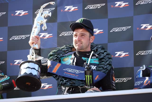 Michael Dunlop (Hawk Racing Honda) celebrates after winning the Superbike TT for his 23rd victory at the Isle of Man TT