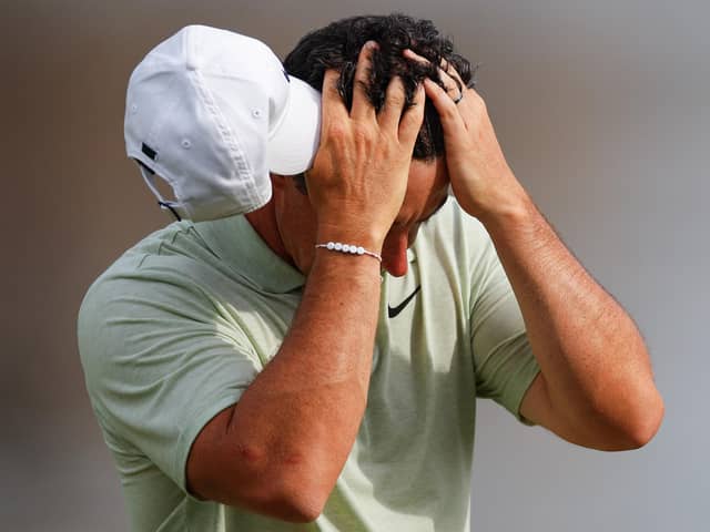 Northern Ireland's Rory McIlroy reacts as he walks off the 18th hole after finishing the final round of the Arnold Palmer Invitational in Orlando, Florida. (Photo by Mike Ehrmann/Getty Images)