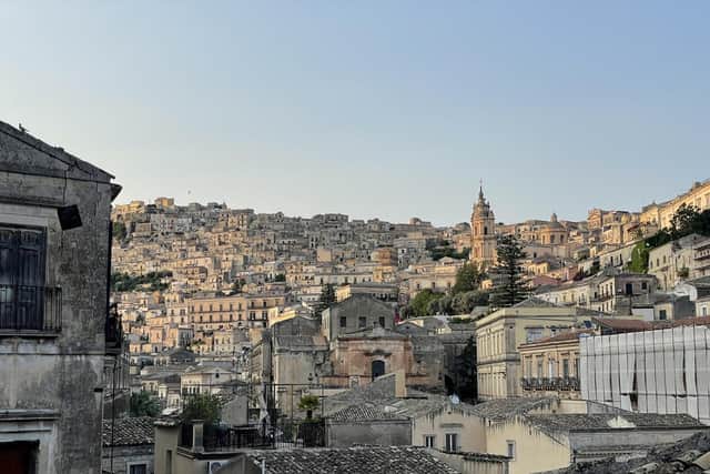 The streets of Modica rising up the hillside.