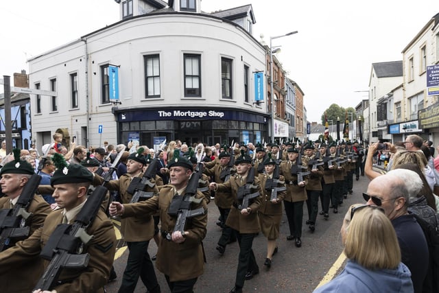 Throngs of spectators have turned out in Ballymena to see the Royal Irish Regiment parade through its streets as part of a military ceremony marking their long connection with the area:-