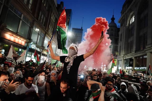 People take part in a Palestine Solidarity Campaign demonstration near the Israeli Embassy, in Kensingston, London,, Monday October 9, 2023. PA Photo. Photo credit should read: Jordan Pettitt/PA Wire