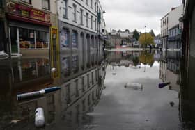 A view of debris and flood water in Sugar Island as the clear up begins in Newry Town, Co Down, which has been swamped by floodwater as the city's canal burst its banks amid heavy rainfall.