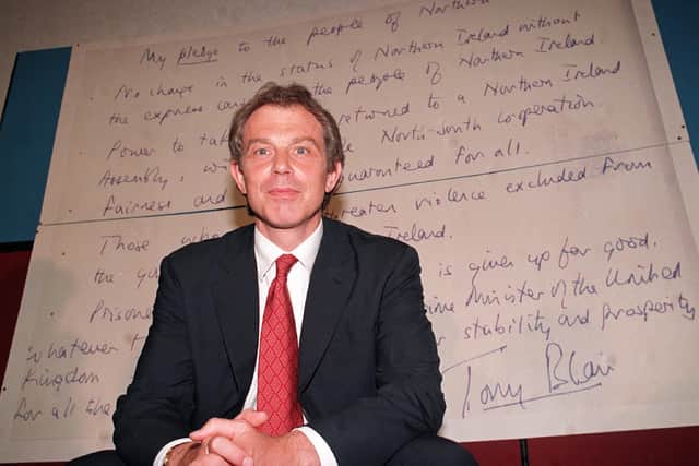 The Good Friday Agreement signing. Prime Minister Tony Blair makes a speach at Coleraine University in front of his had written pledge to the people of Northern Ireland.