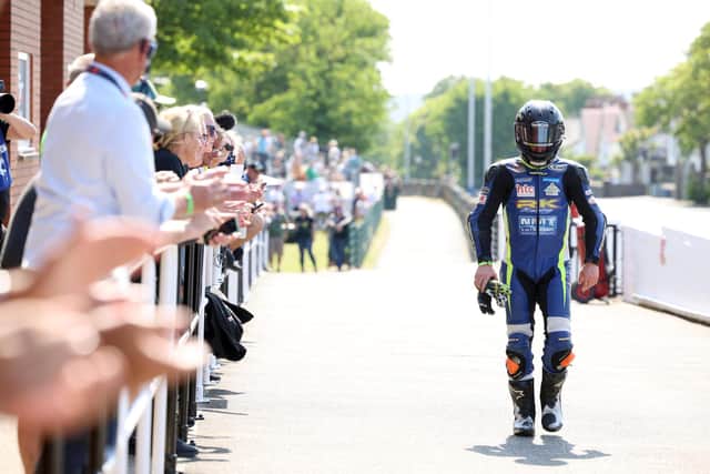 A devastated Mike Browne walks back to the paddock after his Burrows Engineering/RK Racing Paton broke down while he was leading the second Supertwin TT race