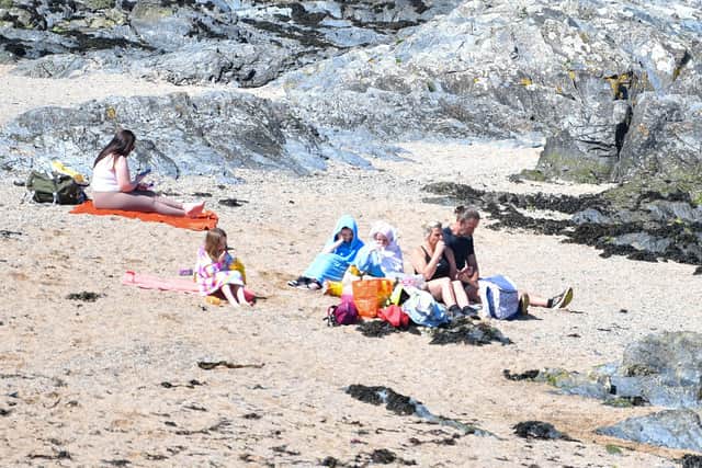 Families enjoy the sun on the beach at Bangor on Sunday 19 May 2024, as the good weather continues. Photo - Andrew McCarroll/ Pacemaker Press