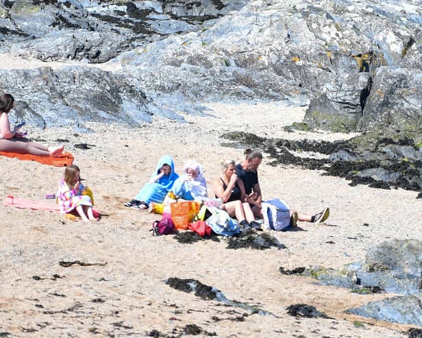 Families enjoy the sun on the beach at Bangor on Sunday 19 May 2024, as the good weather continues. Photo - Andrew McCarroll/ Pacemaker Press