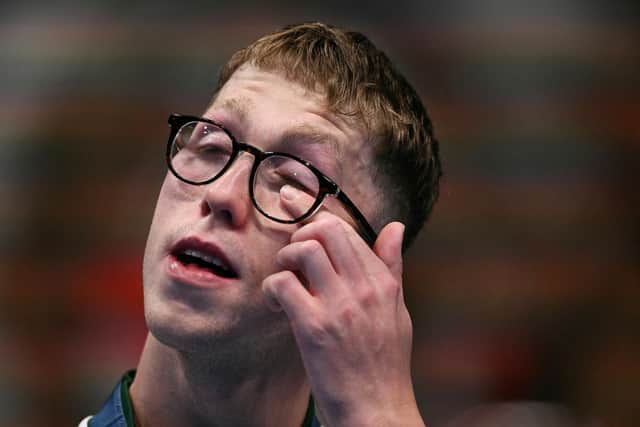 An emotional Daniel Wiffen on the podium in Paris after Tuesday's landmark Team Ireland gold over the men's 800m freestyle final. (Photo by SEBASTIEN BOZON/AFP)