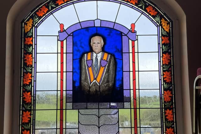 The stained glass window in memory of the late Bro Guy Megarry, dedicated by his family