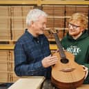 Singer Ed Sheeran (right) and George Lowden with one of the Sheeran by Lowden brand of guitars.