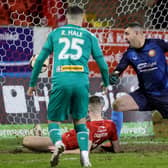 Portadown's Luke Wilson stretches to clear the danger but diverts the ball past goalkeeper Aaron Hogg to give Cliftonville the lead during this evening's game at Shamrock Park, Portadown. PIC: David Maginnis/Pacemaker Press