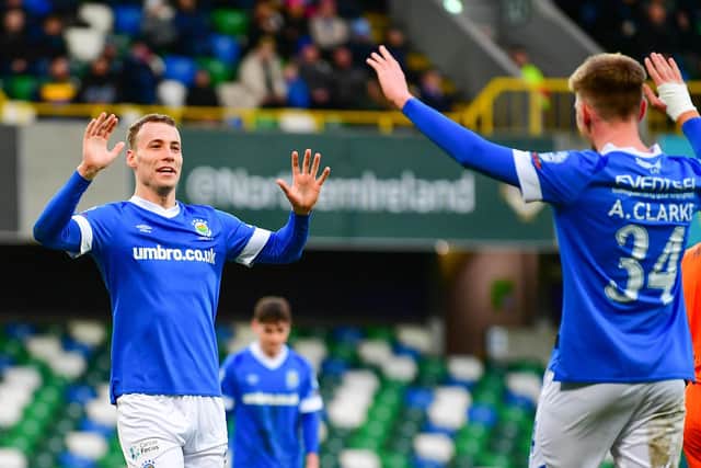 Linfield's Eetu Vertainen and Andrew Clarke celebrate Vertainen's second goal against Ballymena United on Saturday at Windsor Park.