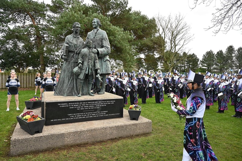 Clover High School Band lays a wreath at Larne war memorial to commemorate American soldiers who trained in the area during the Second World War