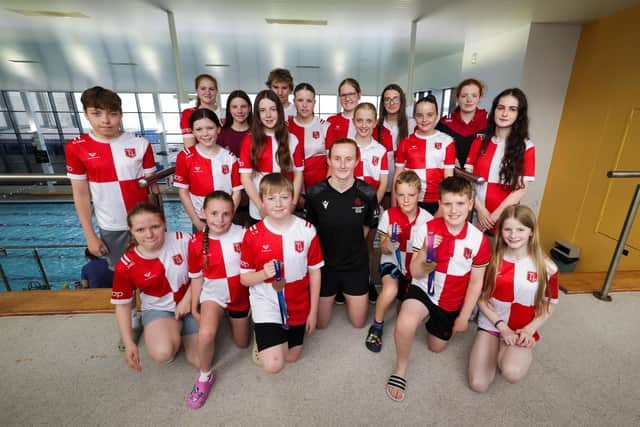 Young swimmers from Larne Swimming Club pictured with Danielle Hill. (Photo: PressEye)