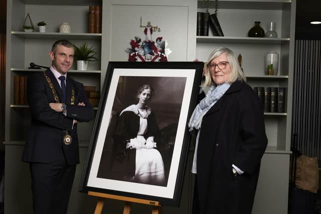 The Law Society of Northern Ireland unveils new portrait of Dorothea Heron, a young woman who made legal history by becoming the first woman Solicitor on the Roll on the island of Ireland. Educated in Belfast, her last remaining years were spent living in Portstewart. Pictured with the portrait are president Darren Toombs and Margaret Elliott past president