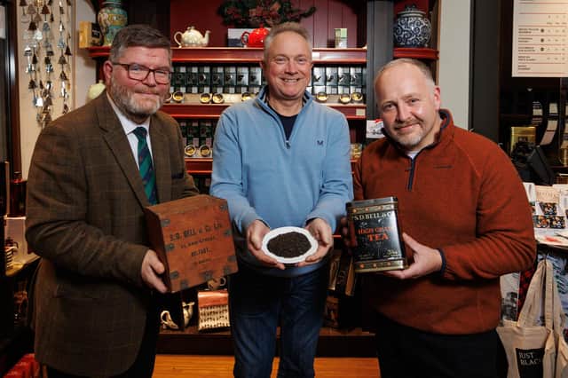 Ulster-Scots Agency chief executive Ian Crozier and Ulster-Scots broadcaster Mark Thompson collecting tea from Robert Bell of SD Bell & Co ahead of their trip to Boston. Photo: Brendan Gallagher