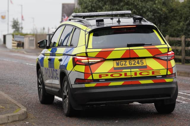 Armed robbers who targetted a shop in Lisburn rammed police cars in Portadown and Newry before escaping across the border.