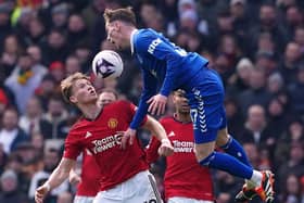 Manchester United's Scott McTominay and Everton's James Garner (right) battle for the ball during the Premier League match at Old Trafford. (Photo by Martin Rickett/PA Wire).