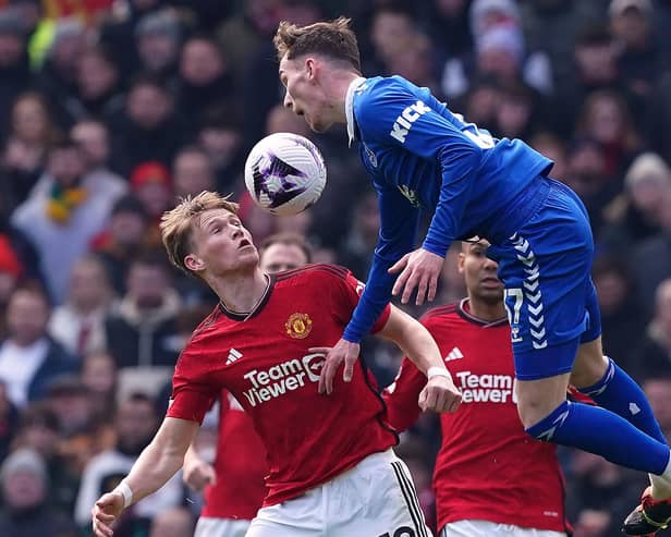 Manchester United's Scott McTominay and Everton's James Garner (right) battle for the ball during the Premier League match at Old Trafford. (Photo by Martin Rickett/PA Wire).