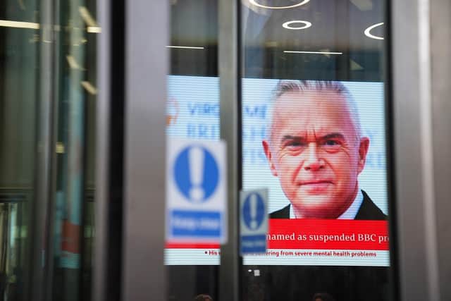 A screen in BBC Broadcasting house, in central London, displaying presenter Huw Edwards who was named by his wife Vicky Flind as the BBC presenter suspended following allegations that he paid a teenager tens of thousands of pounds for sexually explicit images in a statement issued on his behalf. The Metropolitan Police has said no criminal offence has been committed by the presenter. PA Photo by James Manning/PA Wire