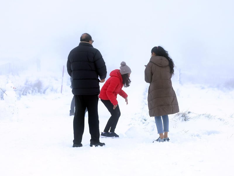 Snow fall on Divis and Black Mountain, West Belfast.Members of the public pictured on Divis Mountain on the outskirts of west Belfast.Picture by Jonathan Porter/PressEye