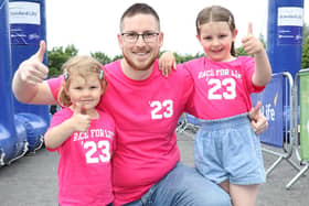 Kieran Drinkwater from Lisburn, with his daughters Ivy, 3, and Eliza, 6, at the Race for Life Belfast