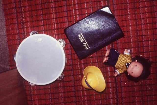 A childs toy, bible and tamborine left in the aisle after the INLA shooting in 1983.
Photo: Pacemaker