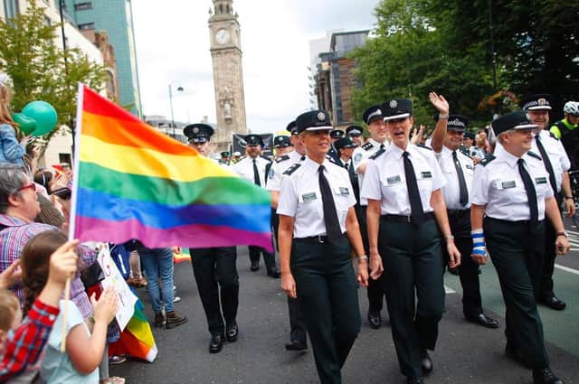 Members of the PSNI and Garda join the Pride parade as it makes it's way through Belfast city centre. Photo: PA 