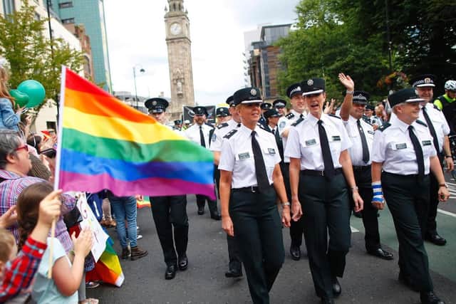 Members of the PSNI and Garda join the Pride parade as it makes it's way through Belfast city centre. Photo: PA